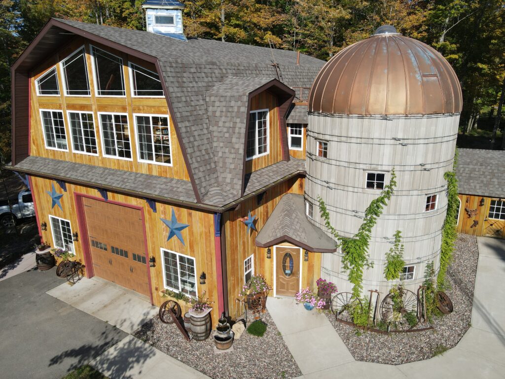 Rustic barn Airbnb near the Wisconsin River offering cozy stays, outdoor space, and scenic forest views.